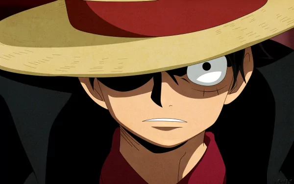 HD desktop wallpaper featuring Monkey D. Luffy from the anime One Piece, showcasing a close-up of his face partially obscured by his signature straw hat.