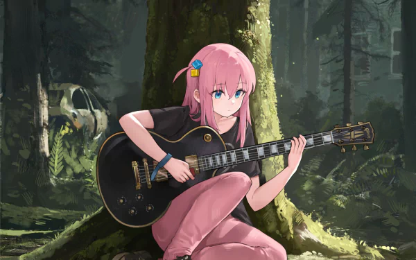Anime character Hitori Gotou from Bocchi the Rock! playing a guitar while sitting against a tree in a forest. HD desktop wallpaper and background.