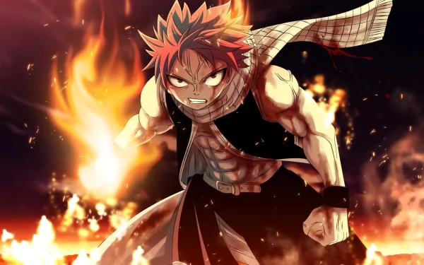 HD desktop wallpaper of Natsu Dragneel from the anime Fairy Tail, wearing a scarf and surrounded by fire, displaying fierce determination and power.