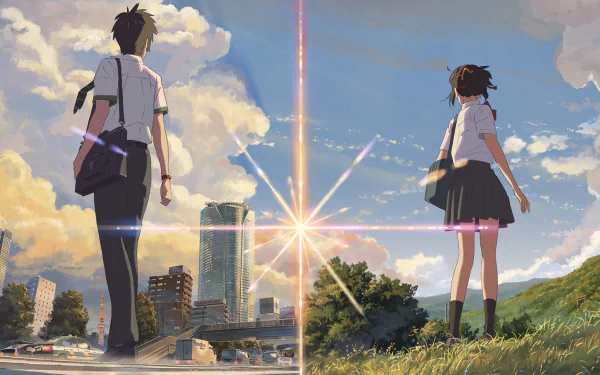 HD desktop wallpaper featuring Taki Tachibana and Mitsuha Miyamizu from Your Name. in school uniforms, standing amidst a scenic backdrop with clouds and a bright sky.