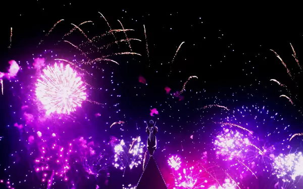 HD anime wallpaper from Demon Slayer: Kimetsu no Yaiba featuring vibrant purple fireworks lighting up the night sky over silhouetted characters.