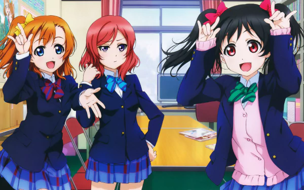 An HD desktop wallpaper featuring Honoka Kousaka, Maki Nishikino, and Nico Yazawa from the anime Love Live! The characters are in a school setting, showcasing vibrant colors and school uniforms.