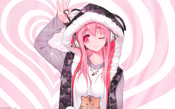An Anime character with pink hair, animal ears, and headphones, winking and smiling. She is wearing a hoodie and blushing. This HD desktop wallpaper features Super Sonico against a pink swirl background.