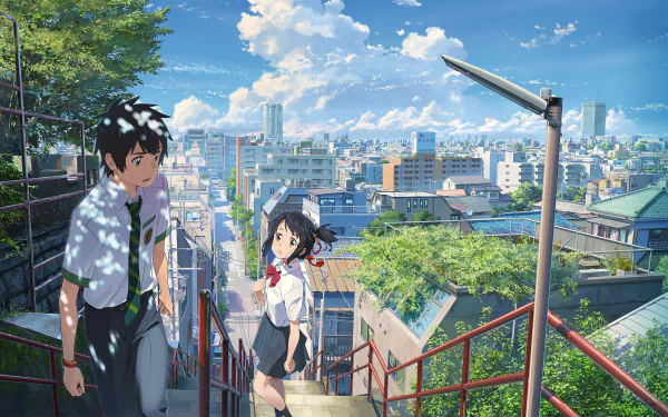 An HD desktop wallpaper featuring anime characters Taki Tachibana and Mitsuha Miyamizu from Your Name. in school uniforms, standing on stairs with a cityscape and blue sky in the background.
