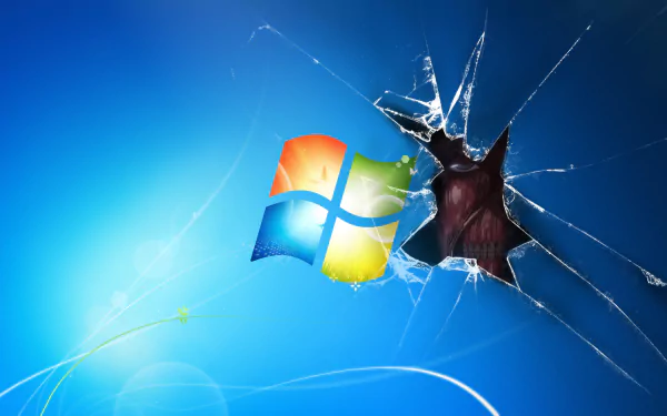 HD desktop wallpaper featuring the Attack on Titan anime with a Windows logo and a shattered glass effect.