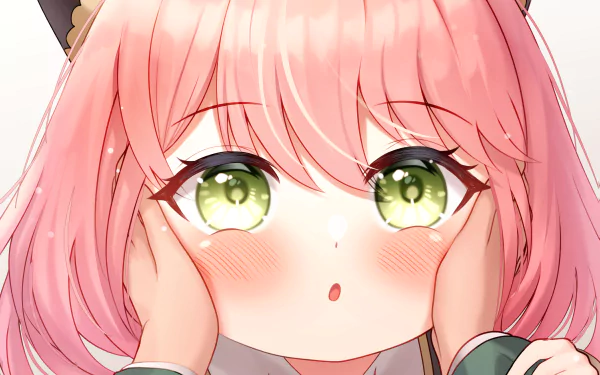 Close-up of Anya Forger from Spy x Family with pink hair and green eyes, showcased in a vibrant 4K Ultra HD anime desktop wallpaper.