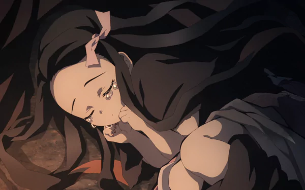 HD PC desktop wallpaper featuring Nezuko Kamado from the anime Demon Slayer: Kimetsu no Yaiba, depicted sleeping peacefully wrapped in dark clothing.