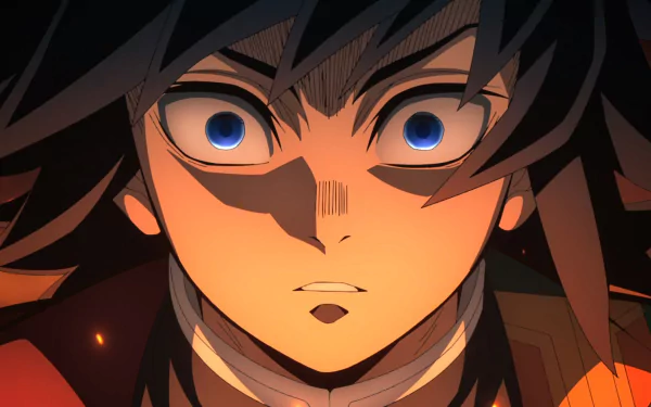 Close-up of Giyuu Tomioka from Demon Slayer: Kimetsu no Yaiba with intense blue eyes and dramatic lighting, featured in an HD anime desktop wallpaper.