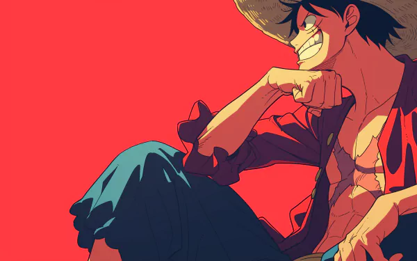 A vibrant HD desktop wallpaper featuring Monkey D. Luffy from One Piece, showcasing his energetic smile and iconic straw hat against a striking red background.