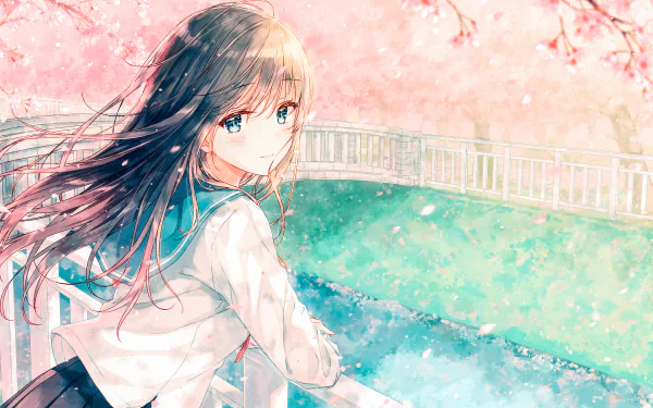 An anime girl in a school uniform with long brown hair and blue eyes blushes while standing by a canal. Cherry blossoms and petals float in the air, creating a picturesque spring scene.