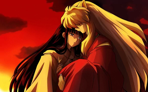 InuYasha and Kikyô share a tender moment against a dramatic sunset in this HD desktop wallpaper, capturing their emotional connection from the anime series InuYasha.
