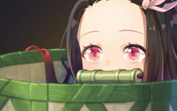 HD desktop wallpaper featuring Nezuko Kamado from Demon Slayer: Kimetsu no Yaiba with pink eyes and brown hair, peeking out of a basket.