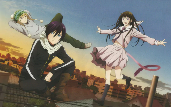 HD desktop wallpaper featuring Yukine, Yato, and Hiyori Iki from the anime Noragami. The characters are set against a sunset cityscape, creating a vibrant and dynamic scene.